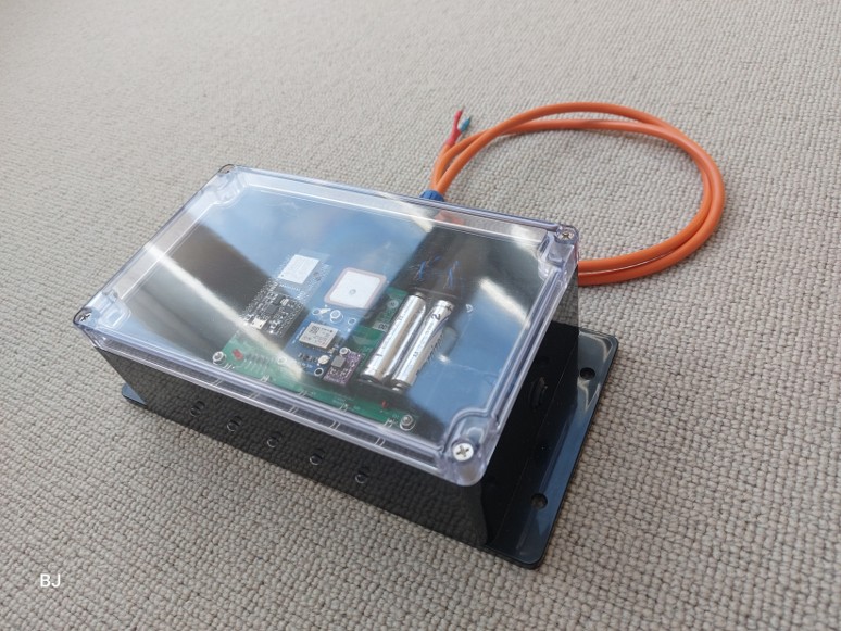 An image of the model turbine electronics inside a sturdy plastic case with lead emerging.